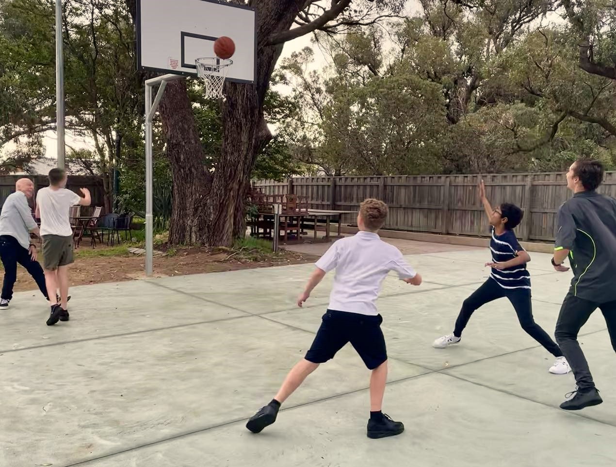 Boarders enjoying the new basketball half court at City Beach Residential College