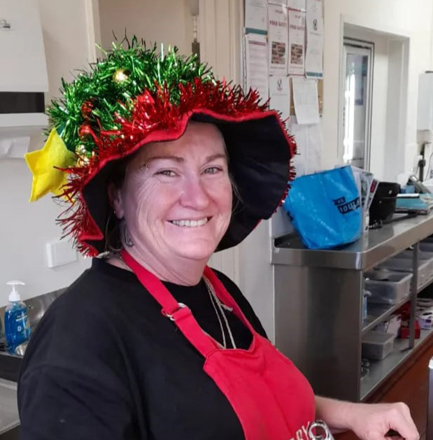 Cook in Christmas costume at Northam Residential College