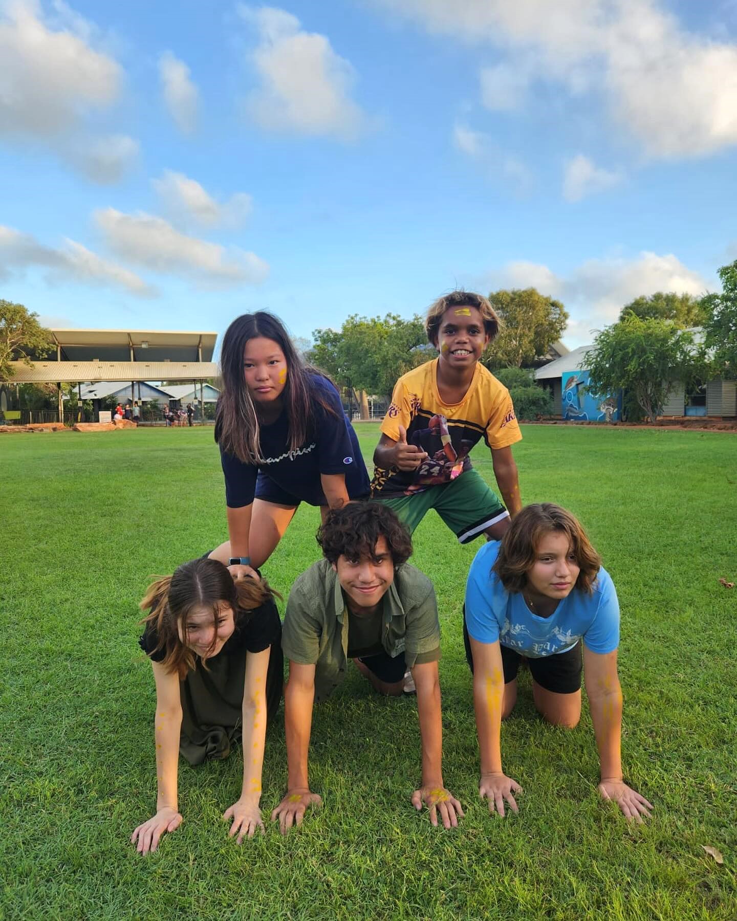 Broome Residential College boarders having fun making a human pyramid