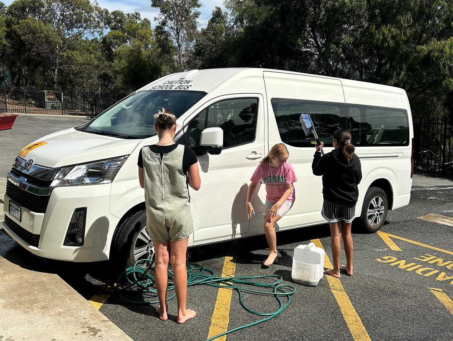 Albany Residential College boarders washing the college bus