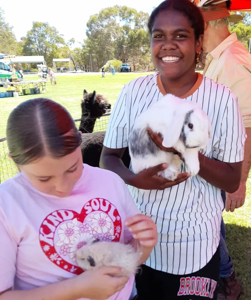 Happy boarders from Northam Residential College with bunnies