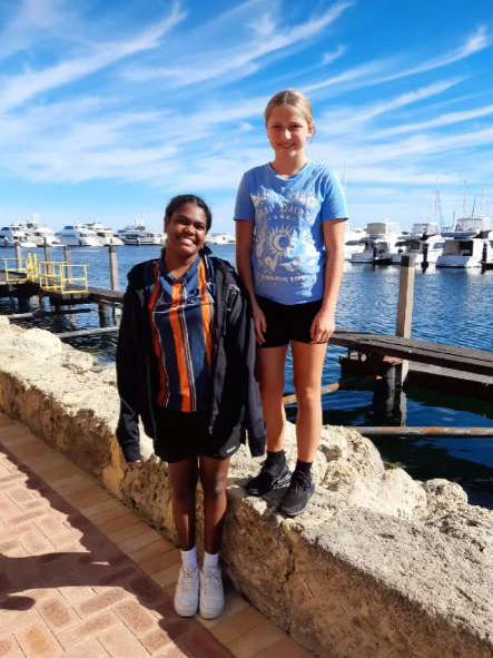 2 Northam Residential College boarders smiling on a sunny day