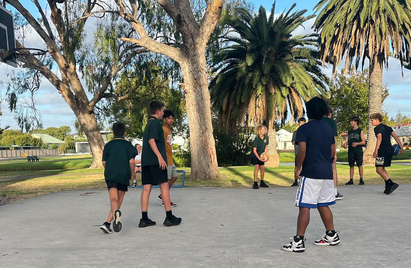 Albany Residential College group of boys playing basketball