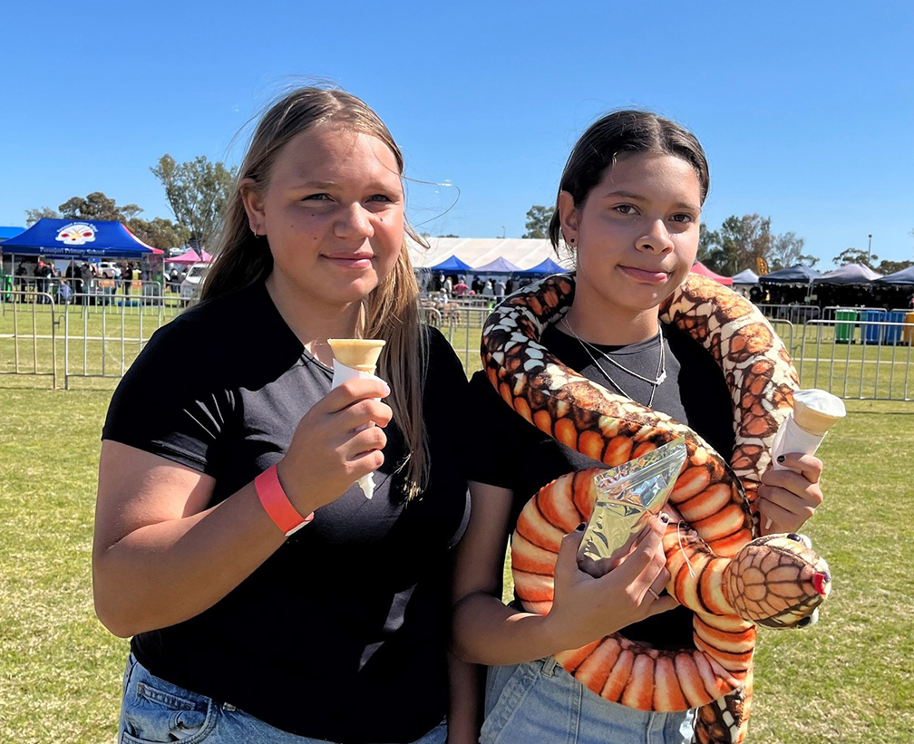 Two smiling girls from Geraldton Residential College enjoying the local show