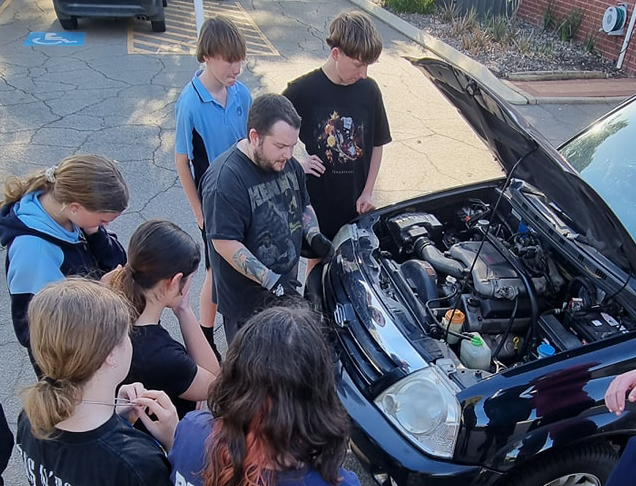 Learning some important life skills (car maintenance) at Moora Residential College