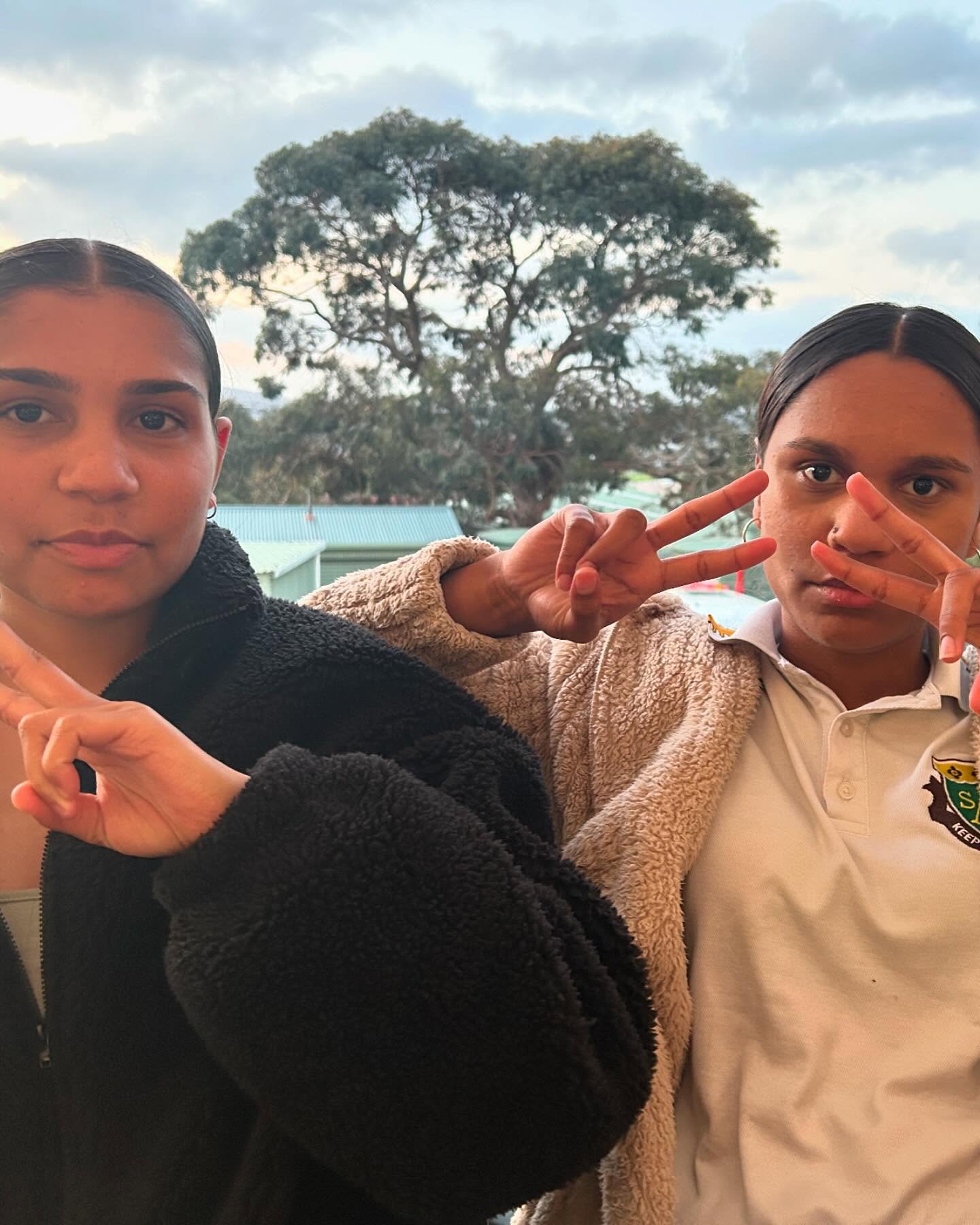 2 Albany Residential College boarders making peace signs