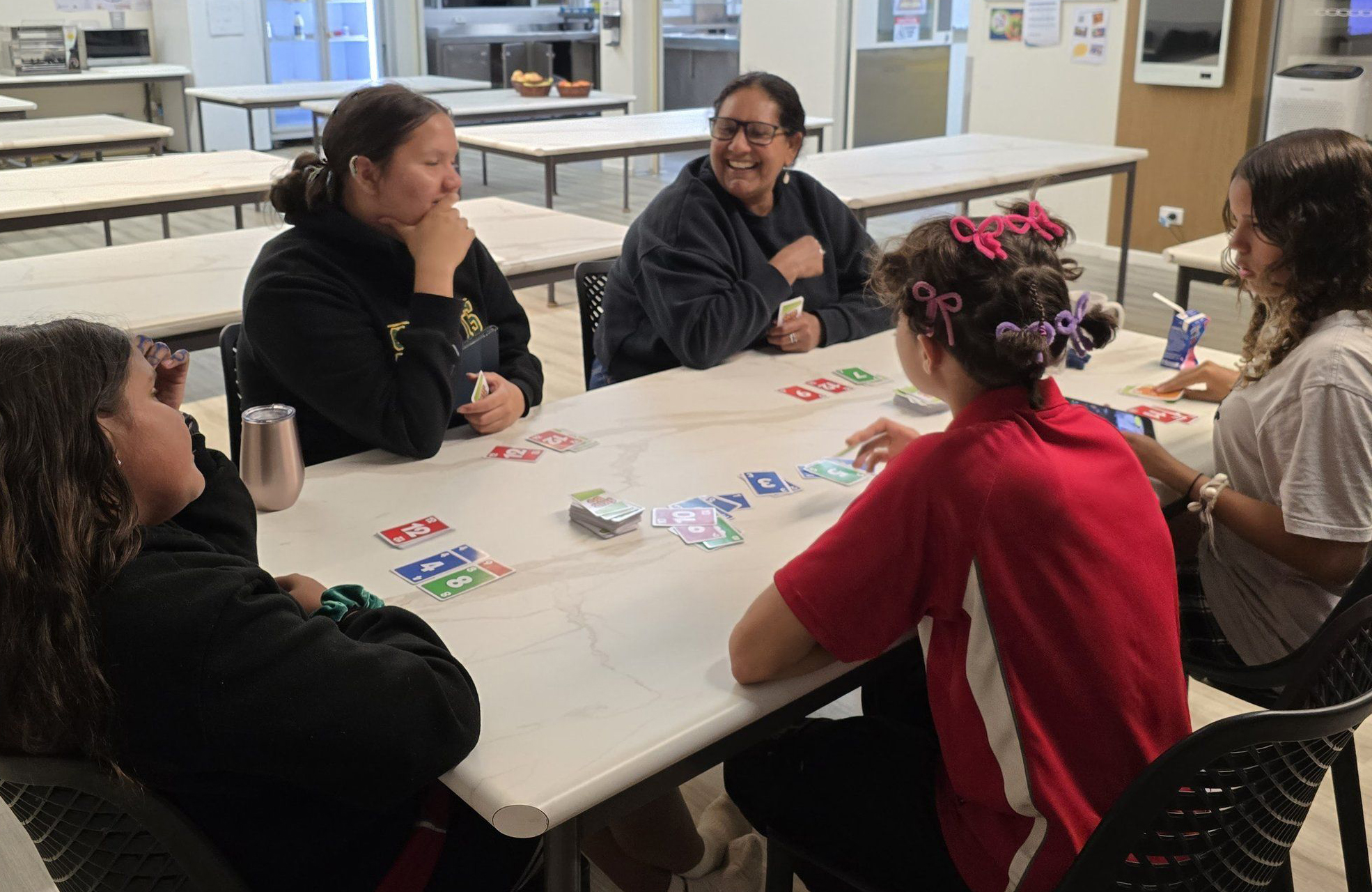 Esperance Residential College boarders and supervisors playing card games