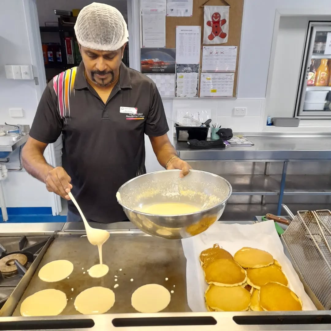 Northam Residential College boarding supervisor cooking some pancakes