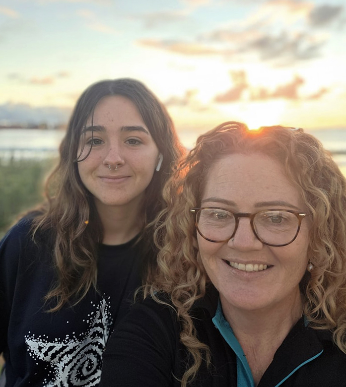 Geraldton Residential College boarding supervisor with a boarder in the sunset.