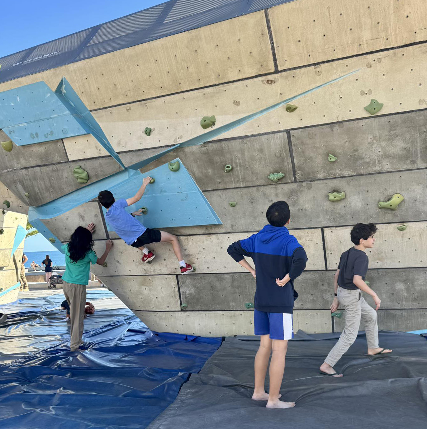 Boudlering at the Scarborough Beach rock climbing wall is a fun activity for our City Beach Residential College boarders.