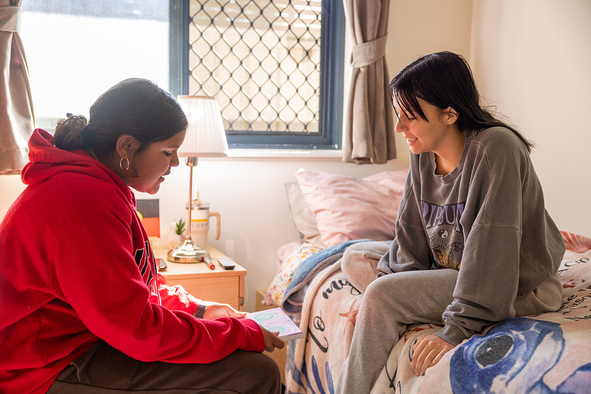 Esperance Residential College boarders sitting together in a bedroom
