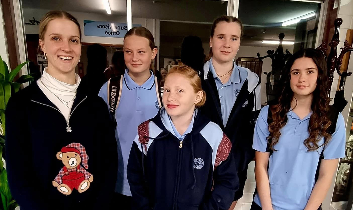 Boarding Supervisor from Moora Residential College with girls ready for school photos.