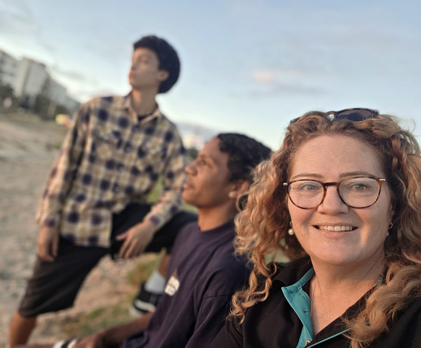 Geraldton Residential College boarding supervisor with boarders at the beach.