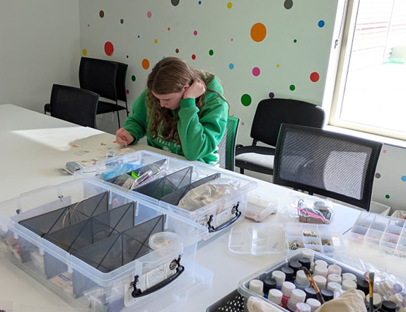 Moora Residential College boarder sitting quietly working on a creative project