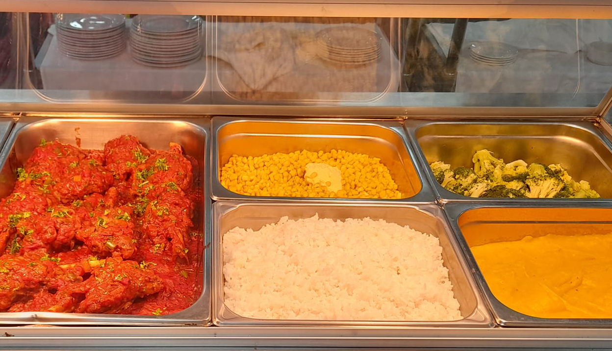 A typical dinner of Chinese chicken, rice and steamed vegetables at Northam Residential College.