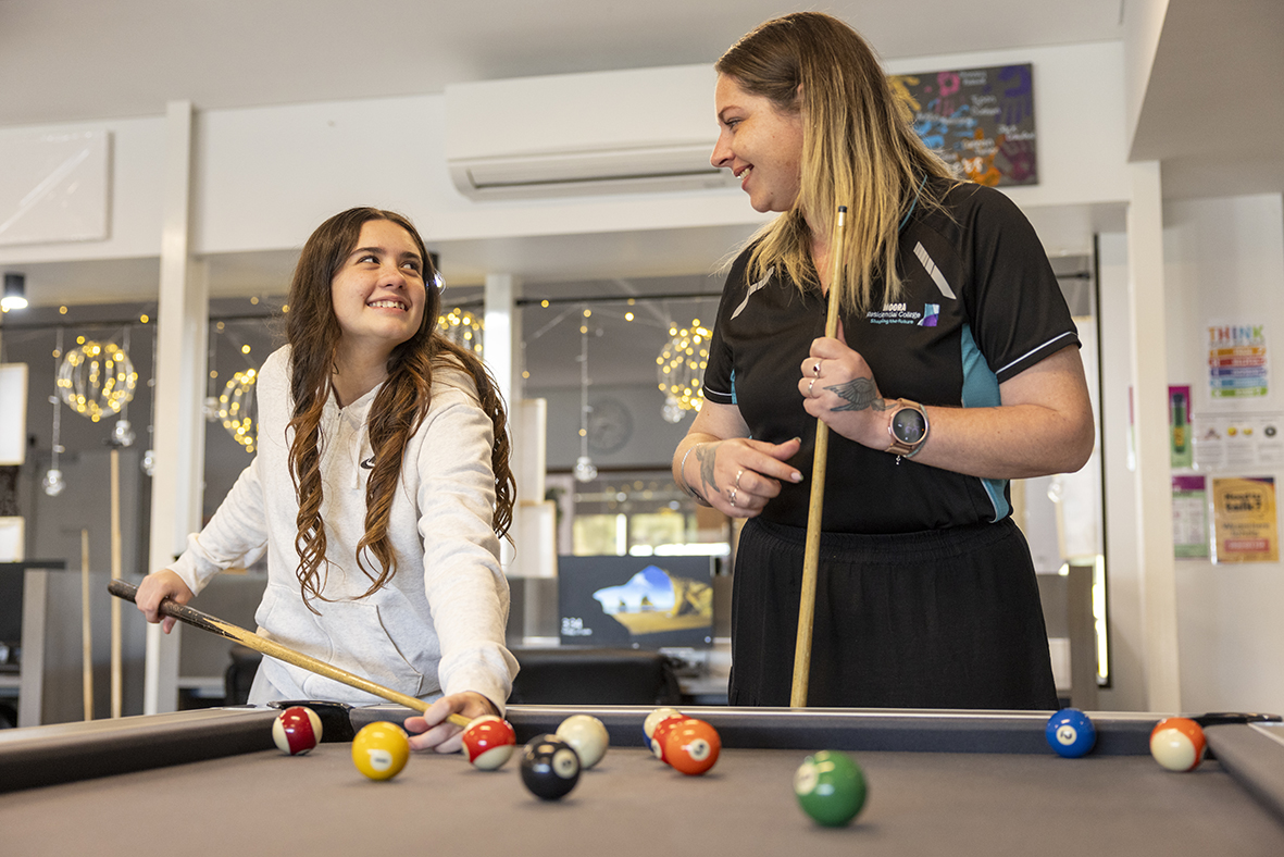 Boarding supervisor from Moora Residential College playing pool with a boarder.