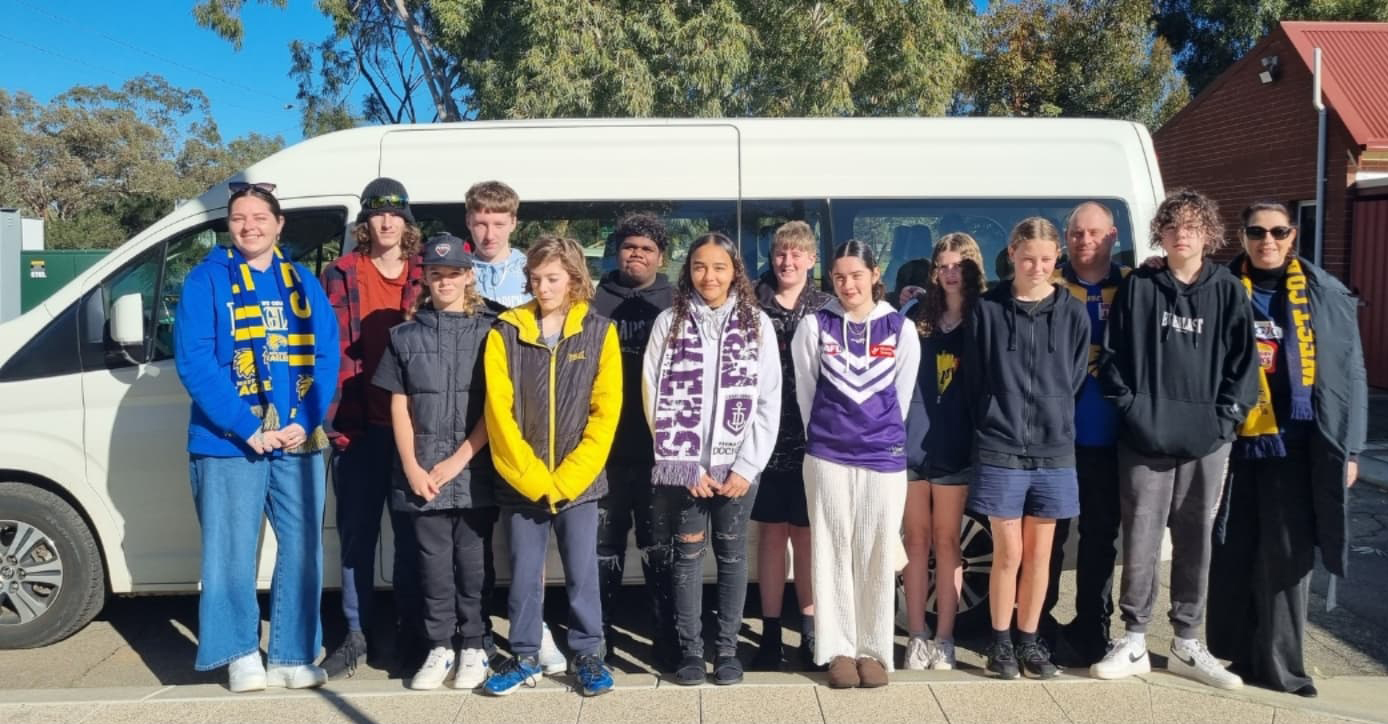 Moora Residential College footy fans heading to Perth on the college minibus for the Western Derby.