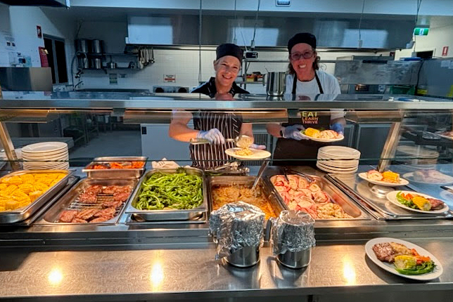 Boarding staff serving up a special dinner for Family Night at Esperance Residential College.