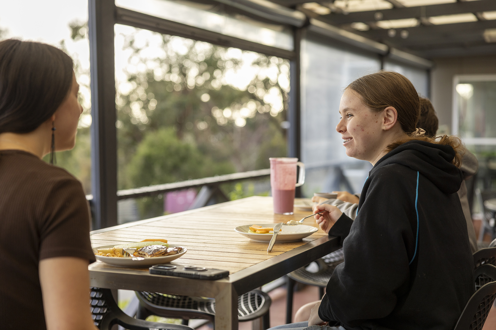 Eating dinner on the balcony at Albany Residential College.