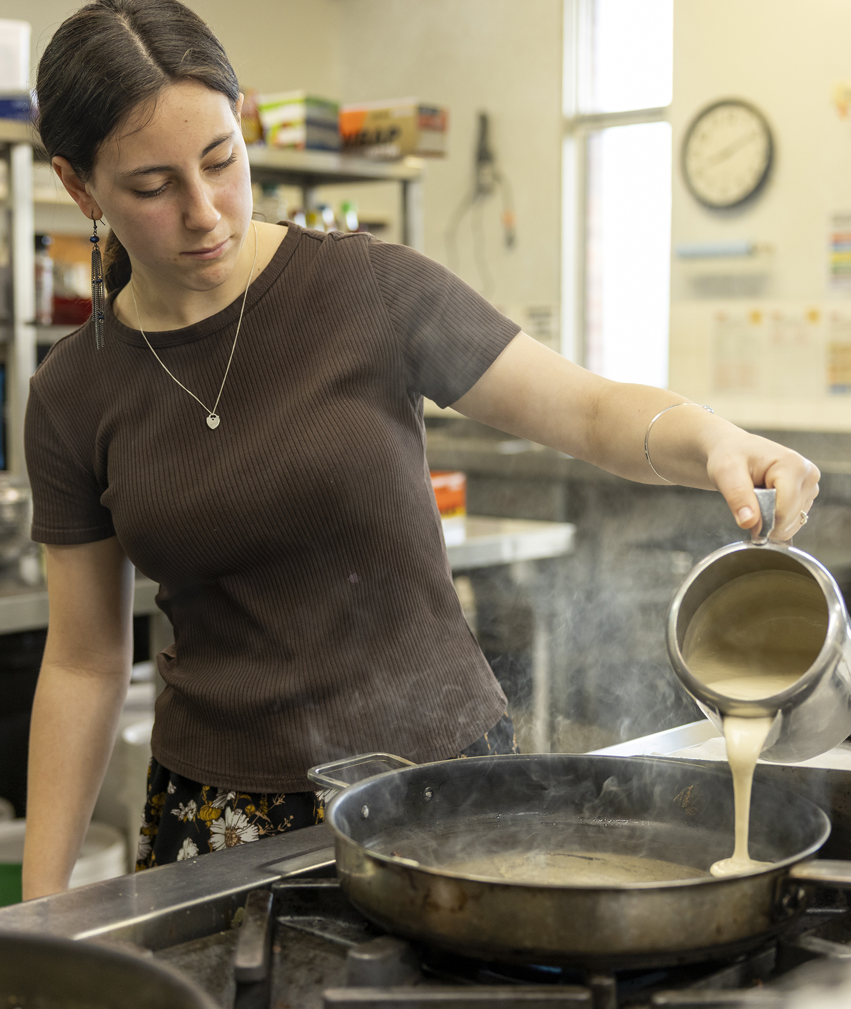 Albany Residential College boarder making pancakes
