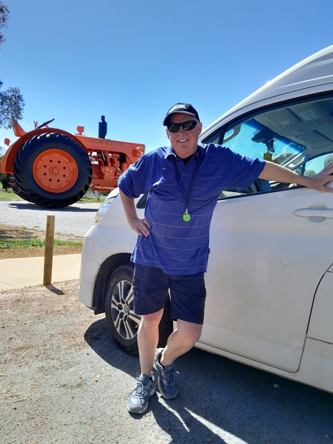 Moora Residential College supervisor standing by the college bus.