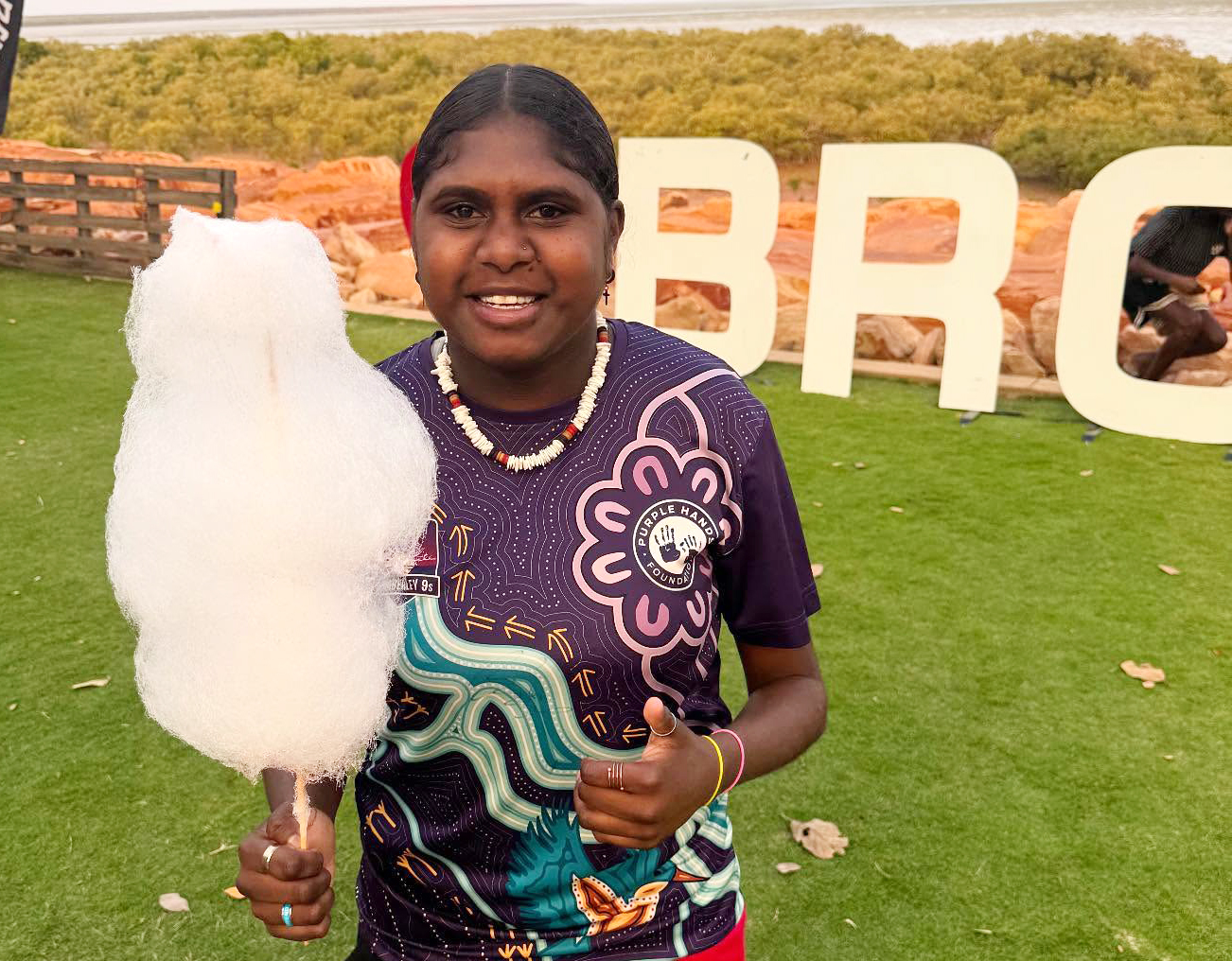 Broome Residential College boarder enjoying some fairy floss by the beach.