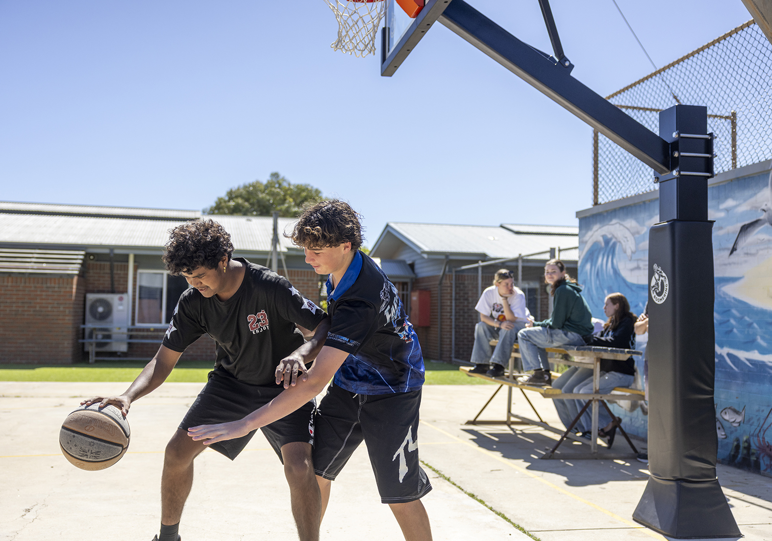 Boarders playing basketball on the Geraldton Residential College outdoor court