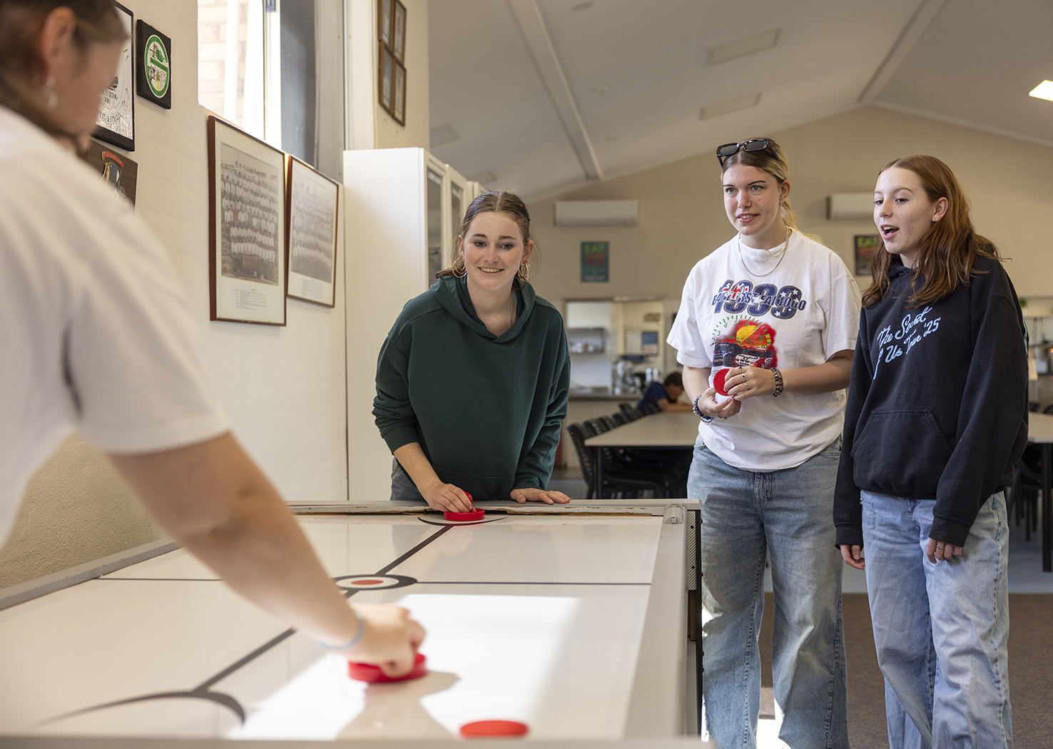 Boarders playing on the foosball table at Geraldton Residential College