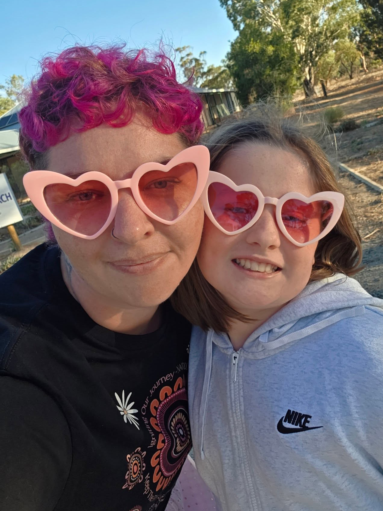 Moora Residential College supervisor and boarder wearing Valentine's Day pink loveheart glasses.