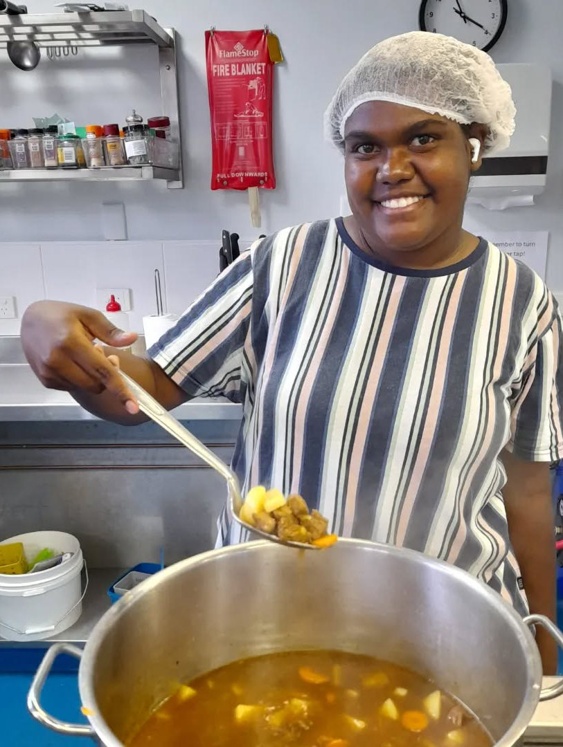 A Northam Residential College boarder cooking up some delicious kangaroo stew for her fellow boarders