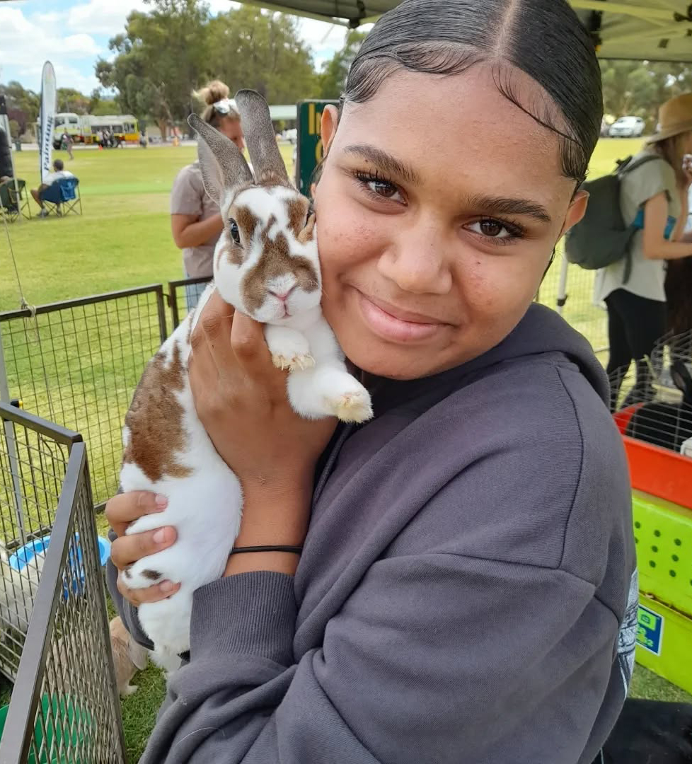 Northam Residential College boarder cuddling a bunny