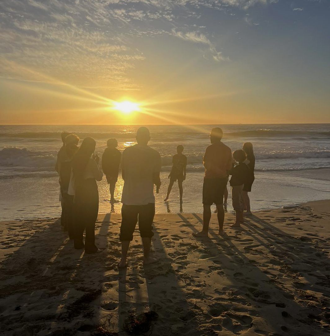 Team-building for City Beach Residential College boarders on the beach at sunset.