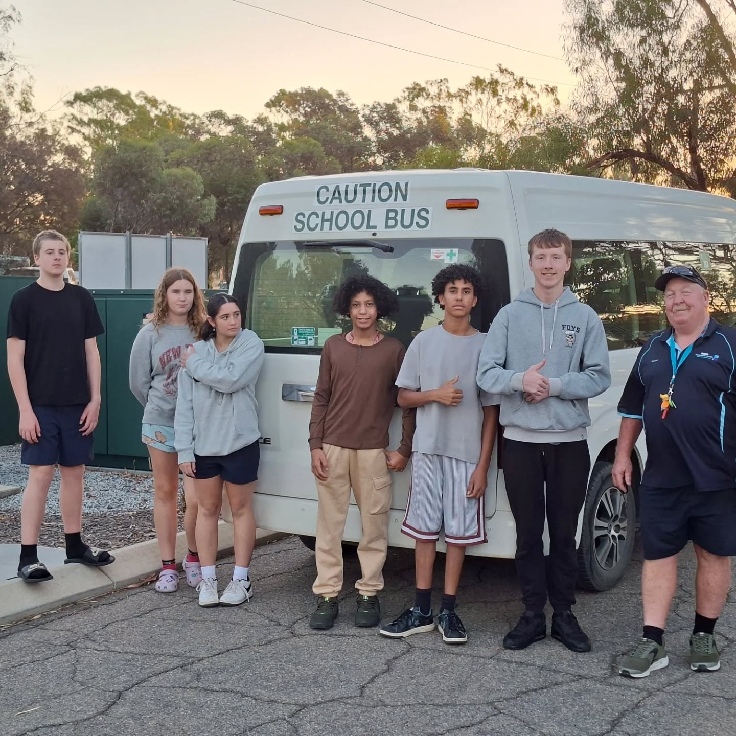 Group of boarders from Moora Residential College standing by the college bus.