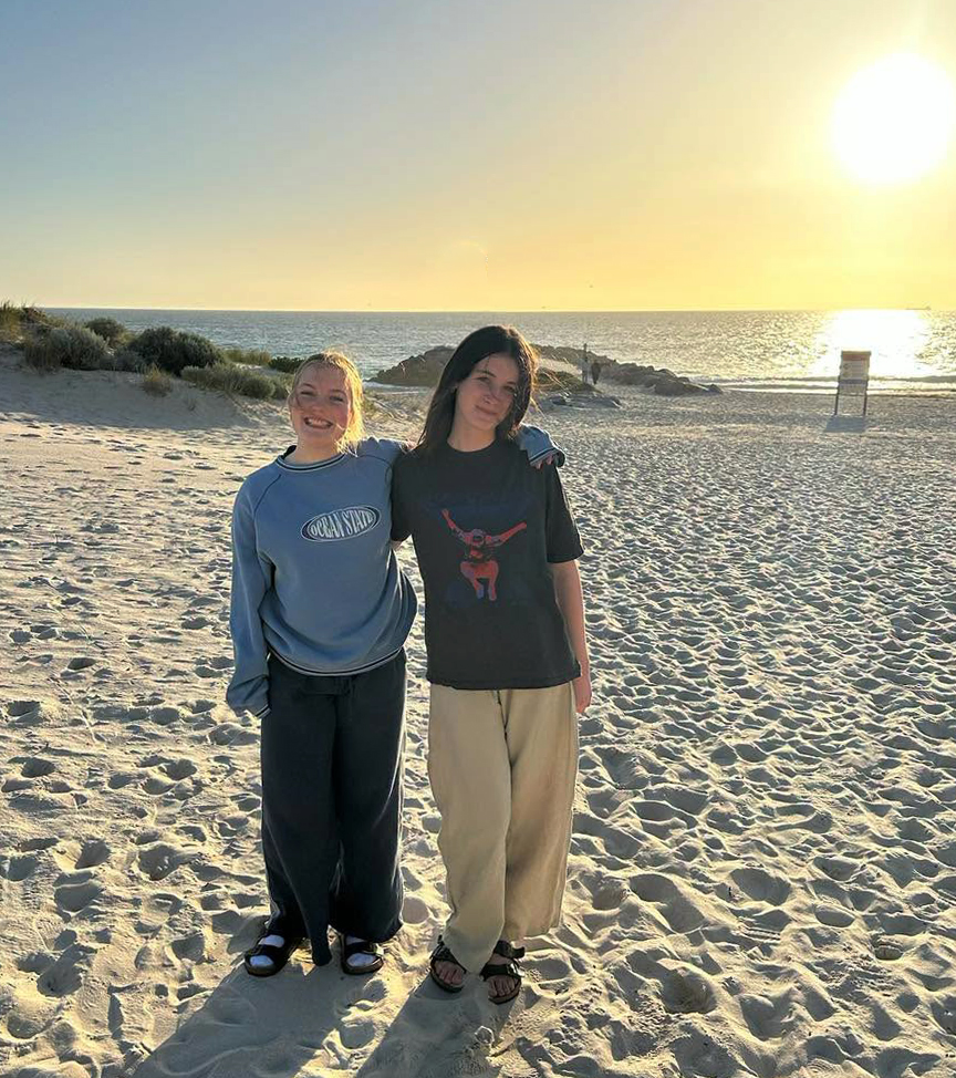 City Beach Residential College boarders enjoying a sunset walk at the beach