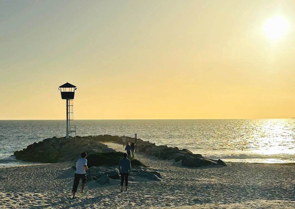 City Beach Residential College boarders on an evening beach sunset walk.