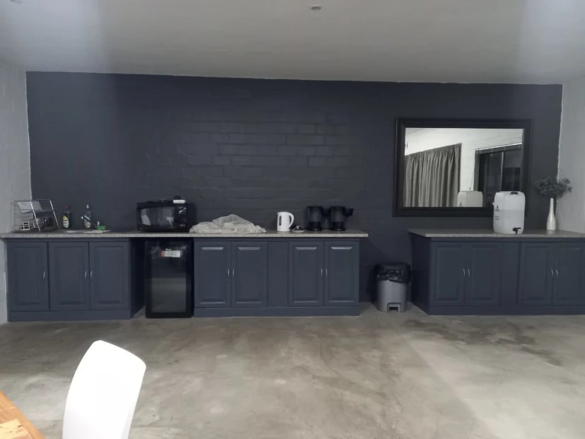 Complete church kitchen view with refinished gray cabinets