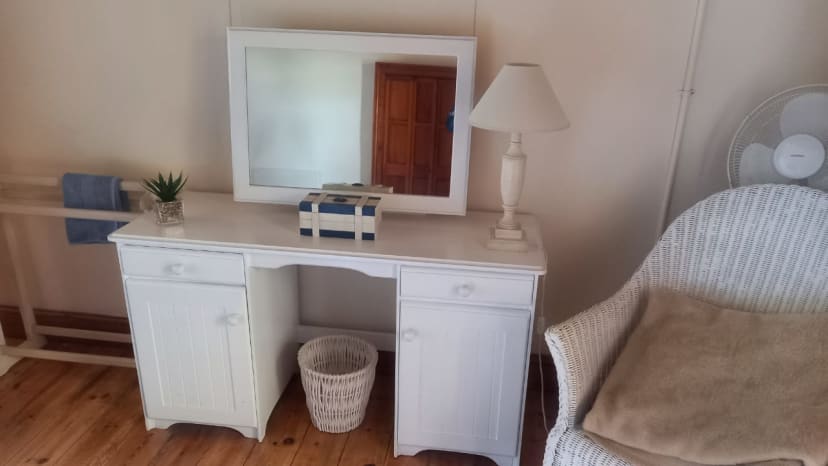Vanity desk with mirror and wardrobe coordination