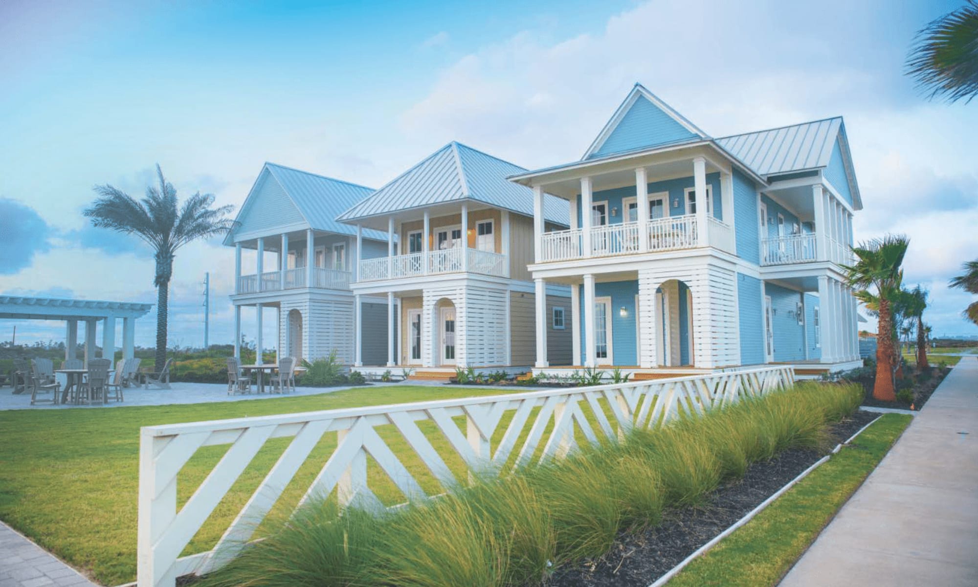 Beach cottages with porches and dune grass in Port Aransas