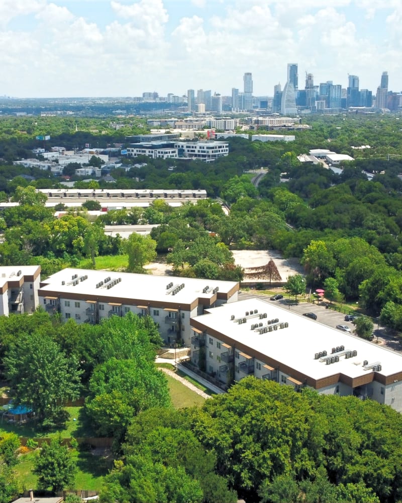 Aerial view of Mirador with the downtown Austin skyline