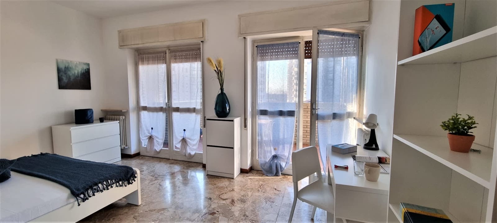 Stanza 15.3 — Singola con letto grande e balcone comune