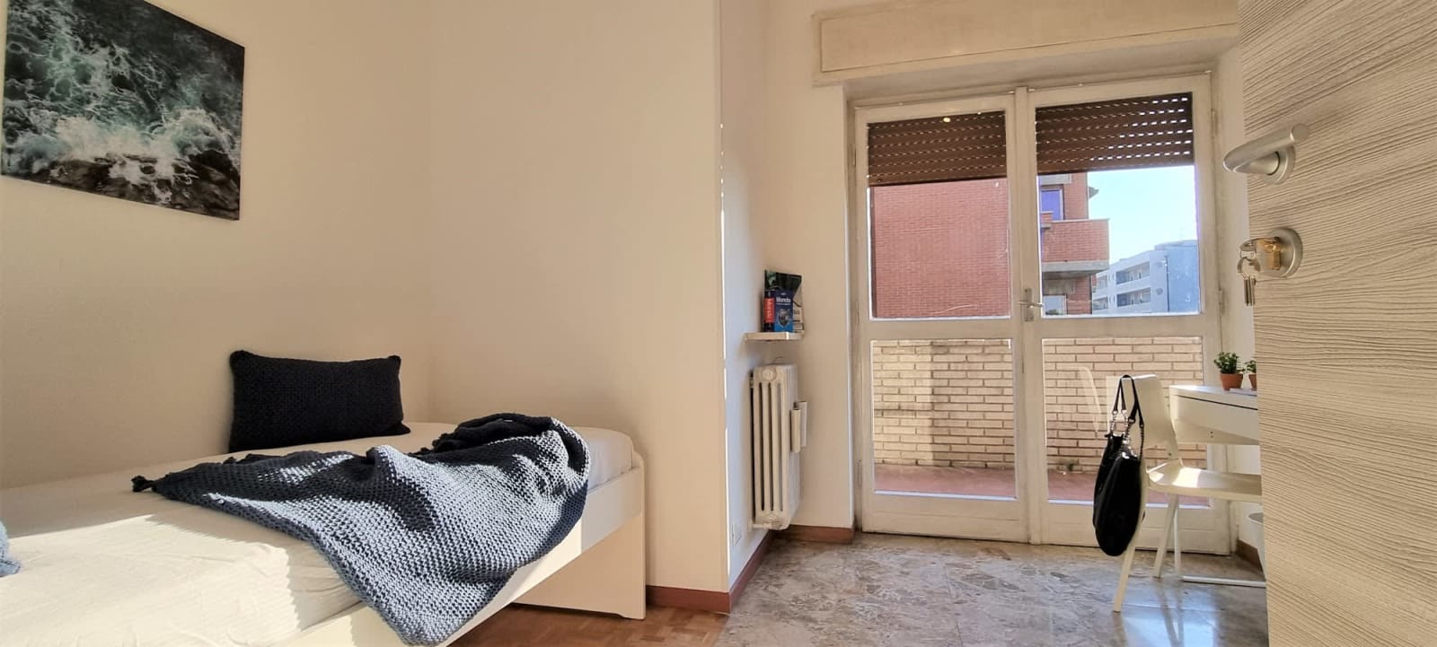 Stanza 15.5 — Singola con balcone privato