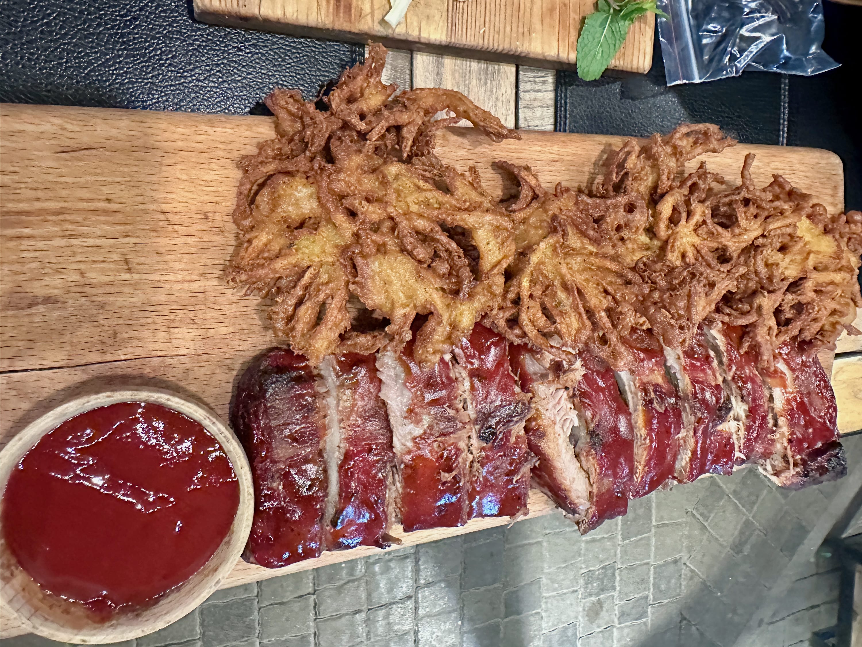 A plate of unique foods sits on a wooden board, offering a taste of Yerevan and promising an unforgettable local experience.