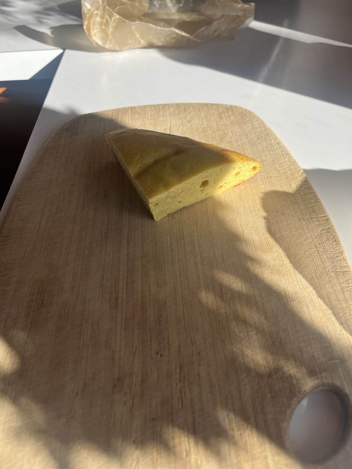 quarter round of finished seitan on a board