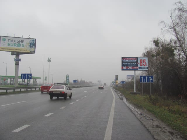 Київ - Житомирське шосе , в напрямку м.Київ, перед с.Міла, (100 м перед заправкою "ТНК"), 7км+200м