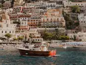 An image of a small yacht on water