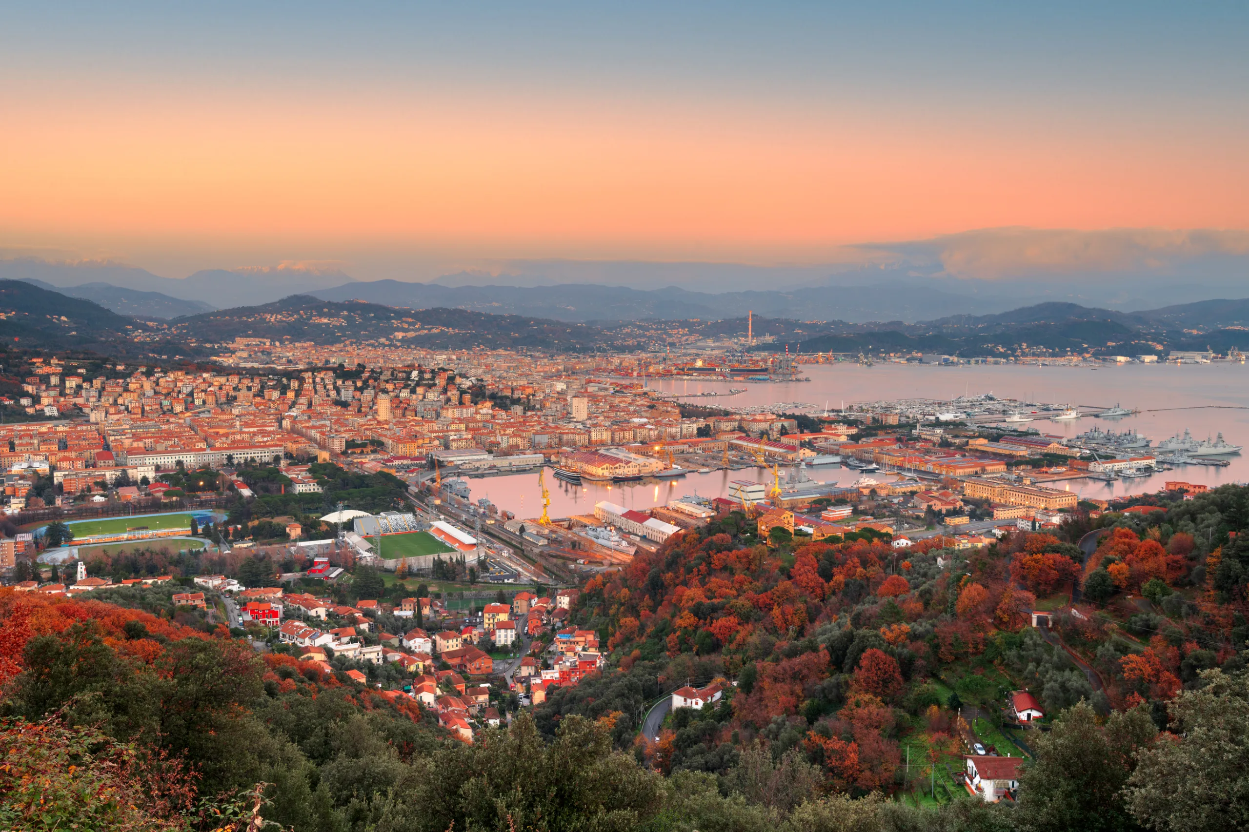 La Spezia, Italy city skyline with the Apennine Mountains at dusk