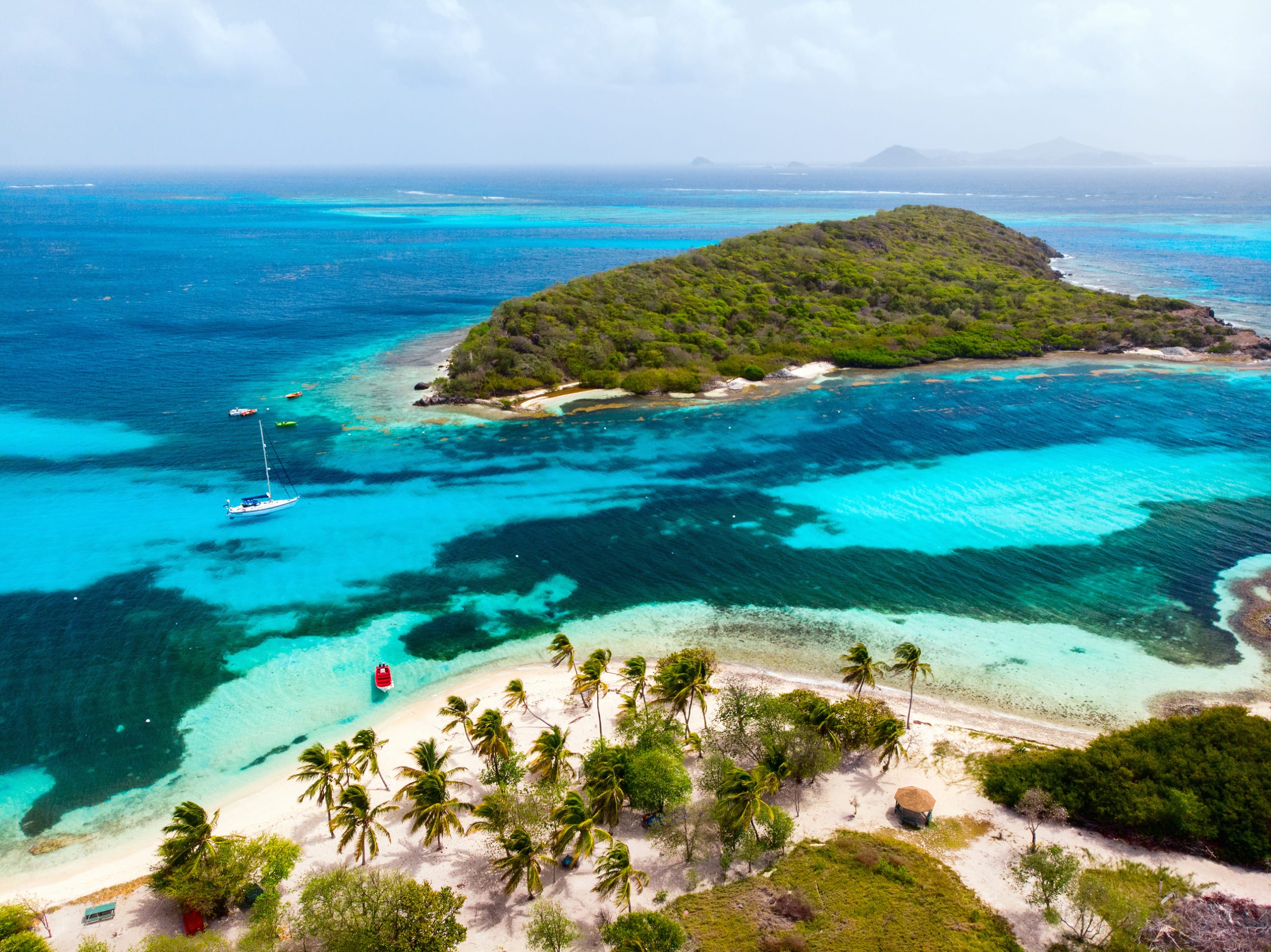 Aerial drone view of tropical islands and turquoise Caribbean sea of Tobago cays in St Vincent and Grenadines