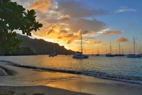 Amazing sunset view seascape. Sailing boat on Bequia island in Saint Vincent and the Grenadines.