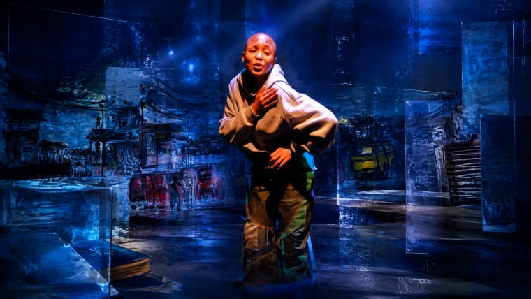 Editorial visual representing The Blue Album as a one-woman theatre work about township memory, queer survival and inherited wounds, featuring an empty blue-lit stage, a single chair, fractured family-photo textures, township doorway silhouettes and premium Viranova purple-blue glass styling.