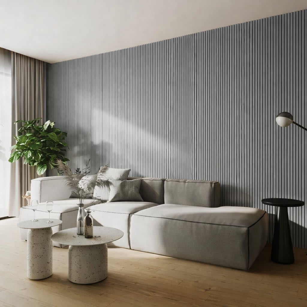 A minimalist interior featuring a tall vertical WPC radiator panel against a light-colored wall, alongside a green potted plant on a warm hardwood floor, evoking modern Scandinavian design and a sense of tranquility.